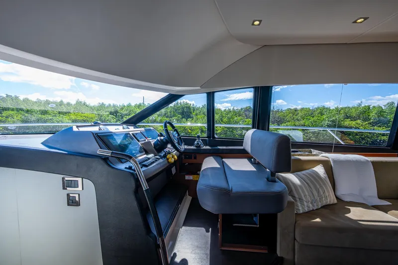 Slide: The Image of Interior of 2012 Prestige Flybridge yacht with modern helm and comfortable seating. - 51
