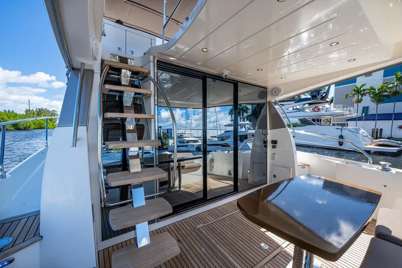 Slide: The Image of Luxurious 2012 Prestige Flybridge yacht interior with modern staircase and sleek design. - 61