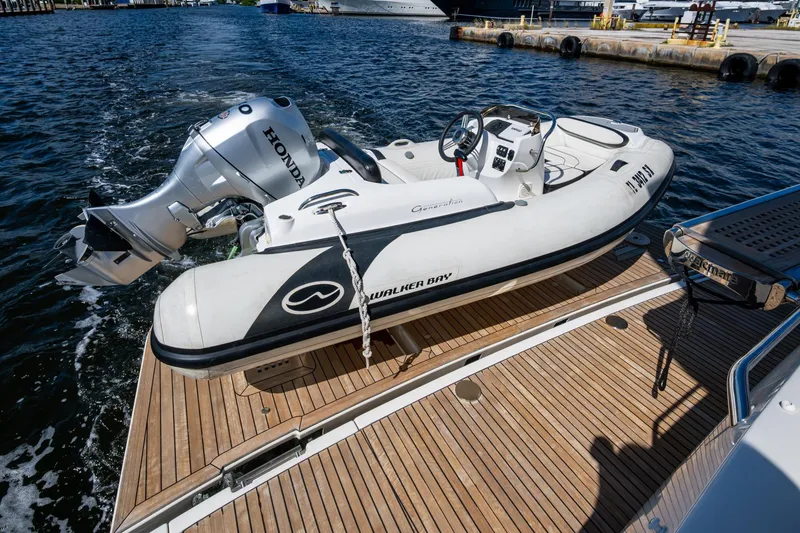 Slide: The Image of Inflatable boat with Honda motor on Prestige Flybridge 2012 yacht deck. - 63