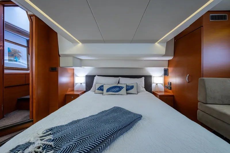 Slide: The Image of Luxurious bedroom interior of 2012 Prestige Flybridge yacht with modern design and cozy bedding. - 78