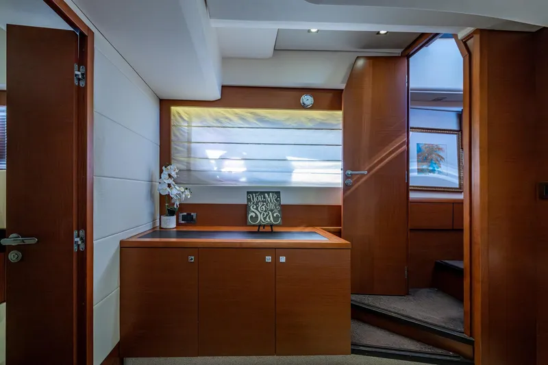 Slide: The Image of Interior of 2012 Prestige Flybridge yacht with elegant wood finish and decorative accents. - 79