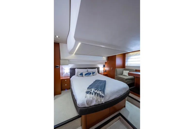 Slide: The Image of Luxurious bedroom interior of 2012 Prestige Flybridge yacht with modern design and cozy furnishings. - 81