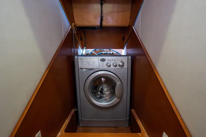 Slide: The Image of Washing machine in 2012 Prestige Flybridge yacht's wooden compartment. - 86