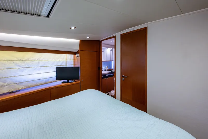 Slide: The Image of Luxurious bedroom interior of 2012 Prestige Flybridge yacht with modern amenities. - 96