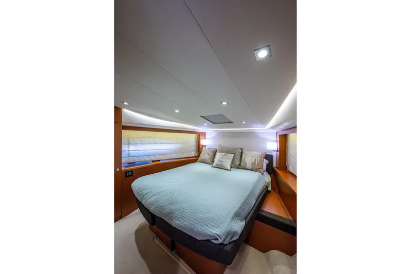 Slide: The Image of Luxurious bedroom interior of 2012 Prestige Flybridge yacht with modern lighting and cozy bedding. - 97