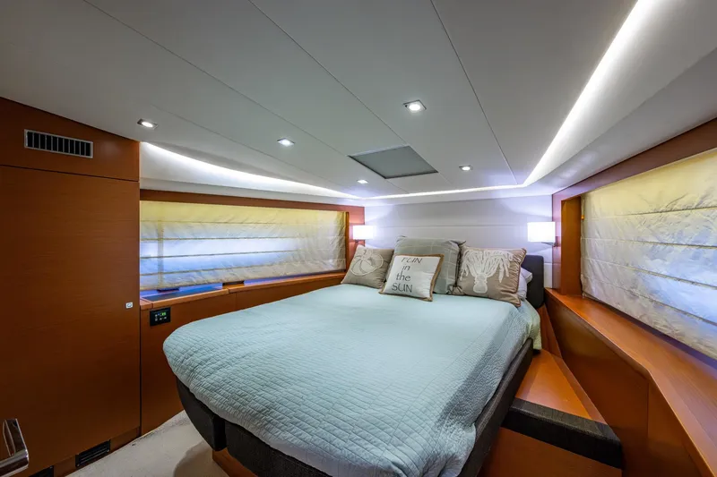 Slide: The Image of Luxurious bedroom interior of 2012 Prestige Flybridge yacht with modern lighting and cozy bedding. - 99