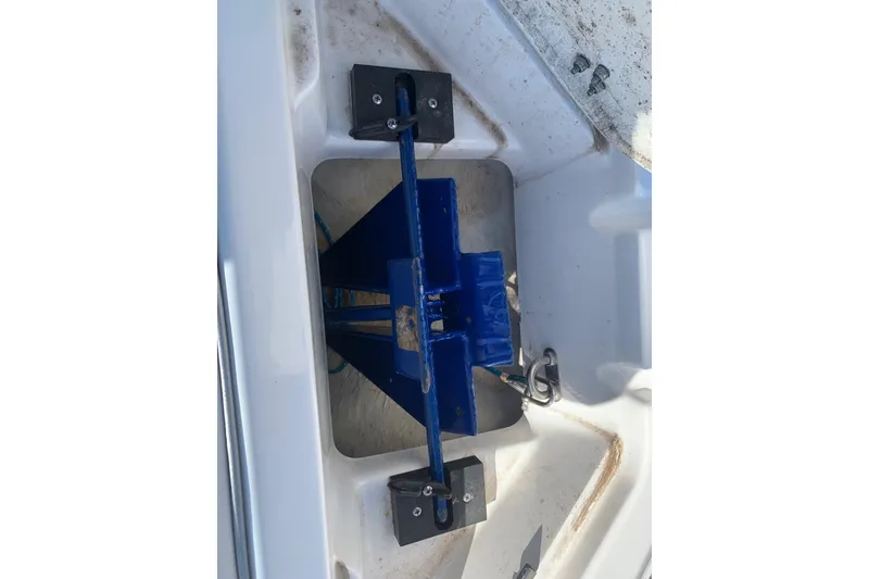 Slide: The Image of 2015 Bryant Calandra boat anchor compartment with blue anchor holder. - 22