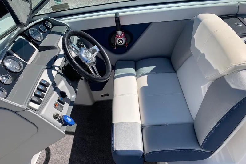 Slide: The Image of 2015 Bryant Calandra boat interior with steering wheel and dashboard controls. - 9