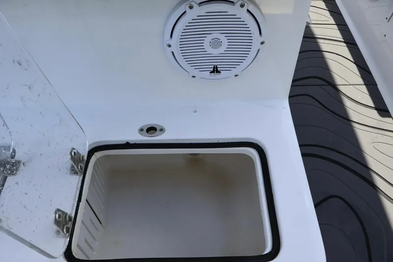 Slide: The Image of Open storage compartment on 2022 Sea Hunt Gamefish 30 Coffin Box boat with speaker. - 15