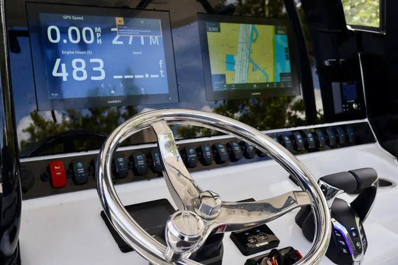 Slide: The Image of Dashboard of 2022 Sea Hunt Gamefish 30 Coffin Box with Garmin displays and controls. - 18