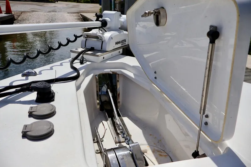 Slide: The Image of 2022 Sea Hunt Gamefish 30 Coffin Box with Minn Kota trolling motor, open storage compartment. - 27
