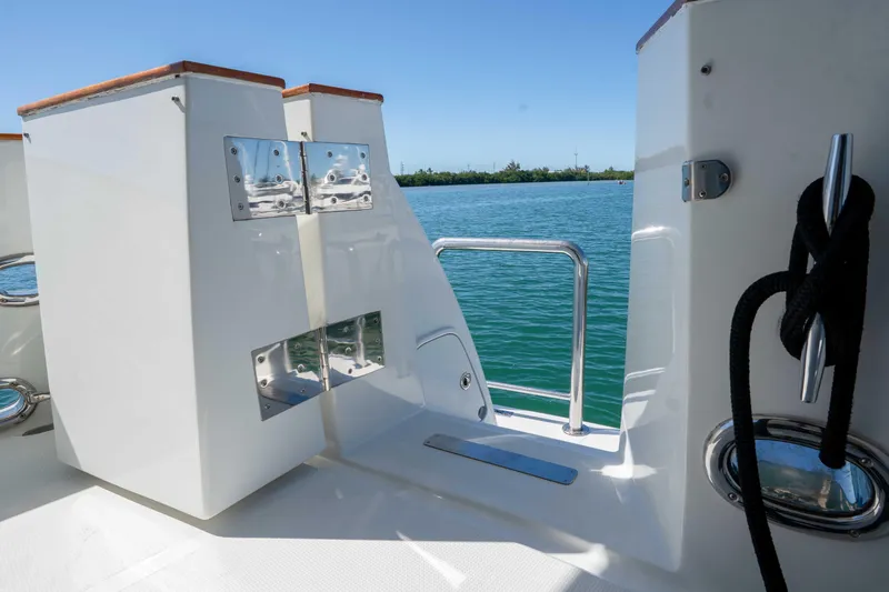 Slide: The Image of 2001 Symbol 62 Pilothouse Yacht deck with stainless steel fittings and ocean view. - 10