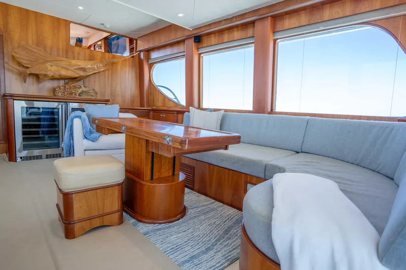 Slide: The Image of Luxurious interior of 2001 Symbol 62 Pilothouse Yacht with elegant wood finishes and seating. - 15