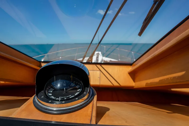 Slide: The Image of Compass view from 2001 Symbol 62 Pilothouse Yacht, overlooking the ocean horizon. - 23