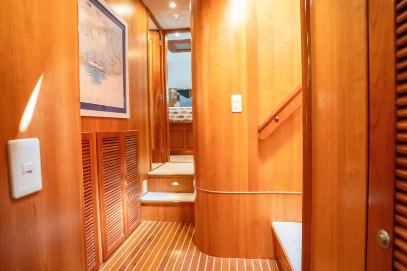 Slide: The Image of Luxurious wooden interior of 2001 Symbol 62 Pilothouse Yacht hallway. - 28