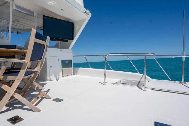 Slide: The Image of Sunny deck of 2001 Symbol 62 Pilothouse Yacht with ocean view and seating area. - 41