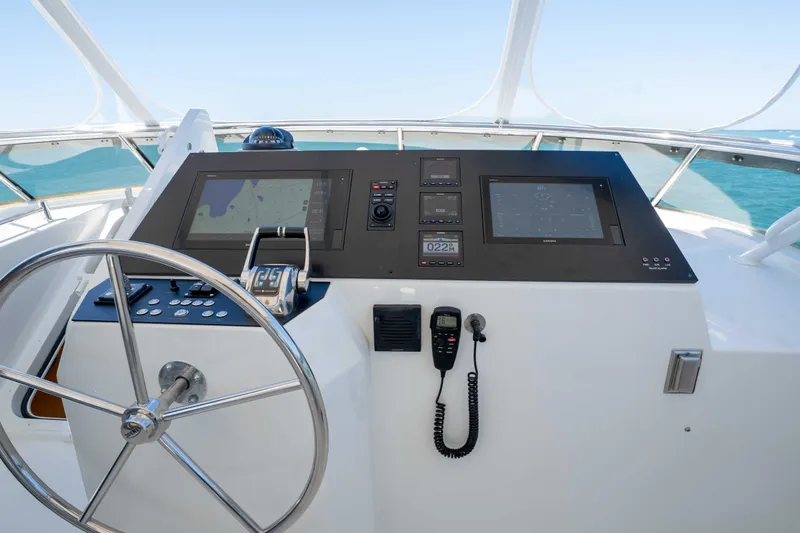 Slide: The Image of Pilothouse of 2001 Symbol 62 Yacht with navigation controls and steering wheel. - 45