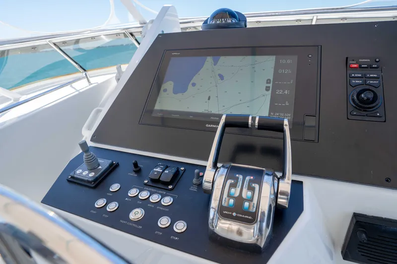 Slide: The Image of Control panel of a 2001 Symbol 62 Pilothouse Yacht with navigation display. - 46
