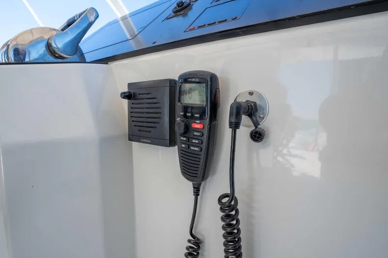 Slide: The Image of Marine radio and speaker on 2001 Symbol 62 Pilothouse Yacht dashboard. - 49