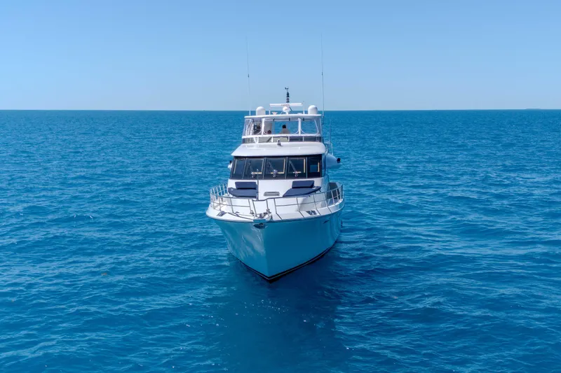 Slide: The Image of 2001 Symbol 62 Pilothouse Yacht cruising on open blue sea. - 5