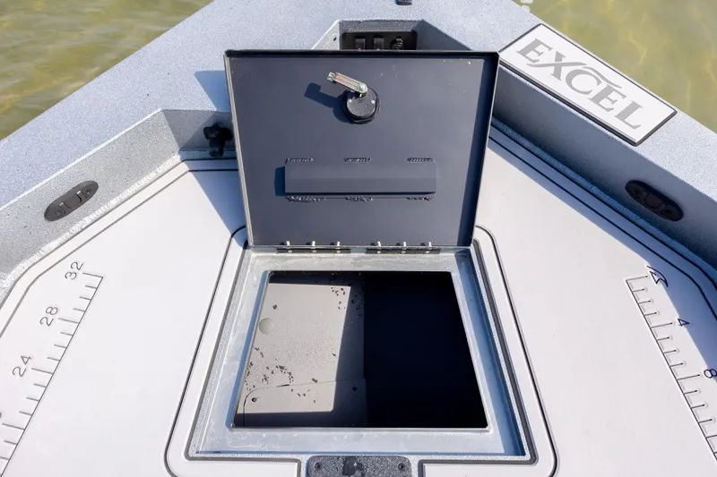 Slide: The Image of Open storage compartment on 2026 Excel 220 Bay Pro Elite boat deck. - 13