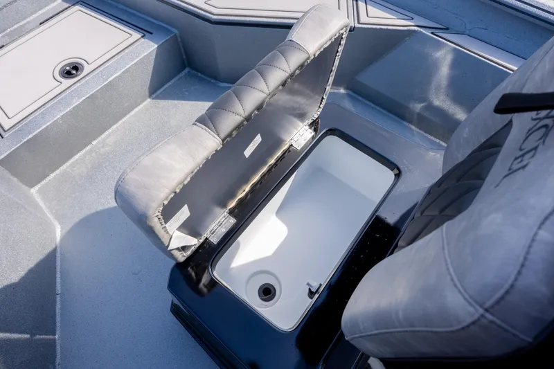 Slide: The Image of 2026 Excel 220 Bay Pro Elite boat seat with storage compartment open. - 20