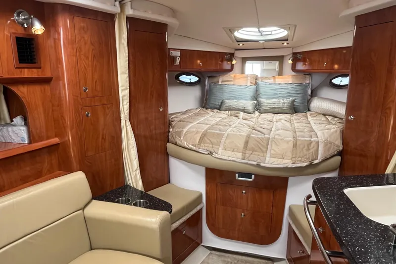 Slide: The Image of Interior of 2008 Four Winns 338 Vista yacht with cozy bed and elegant wood finish. - 11