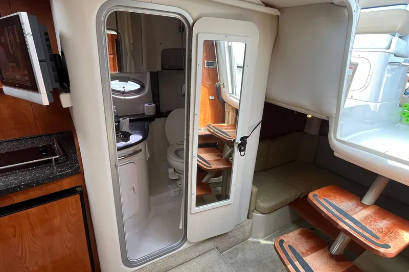 Slide: The Image of Interior of 2008 Four Winns 338 Vista boat with kitchenette and seating area. - 22