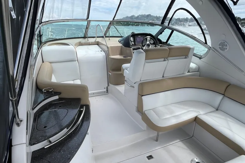 Slide: The Image of 2008 Four Winns 338 Vista yacht interior with white and beige seating, sleek design. - 28