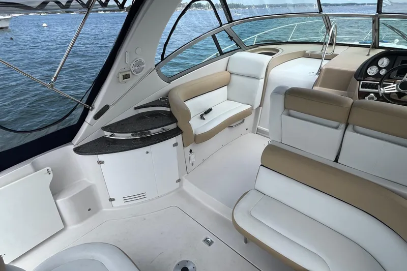 Slide: The Image of Interior of 2008 Four Winns 338 Vista boat with seating and helm, overlooking water. - 30