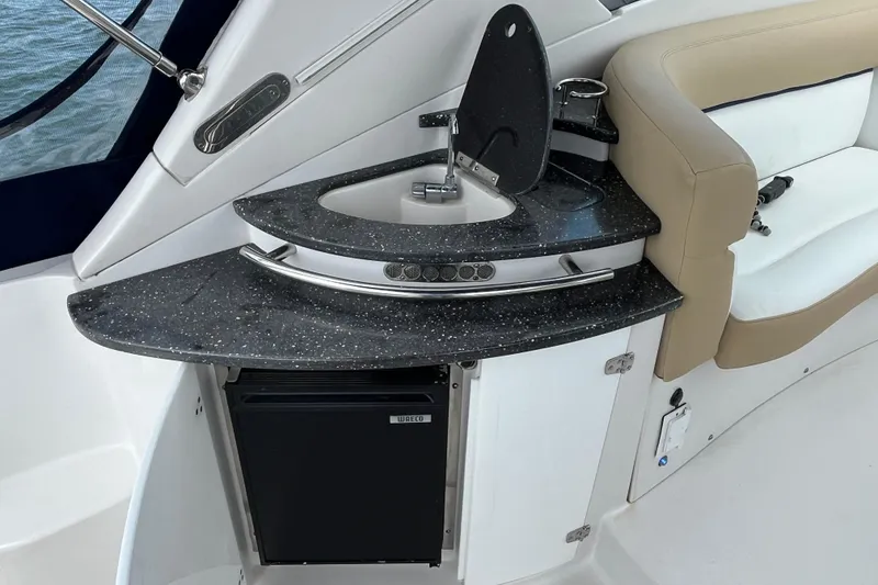 Slide: The Image of 2008 Four Winns 338 Vista boat interior with kitchenette and seating area. - 31