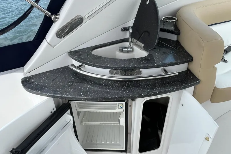 Slide: The Image of 2008 Four Winns 338 Vista boat interior with kitchenette and mini fridge. - 32