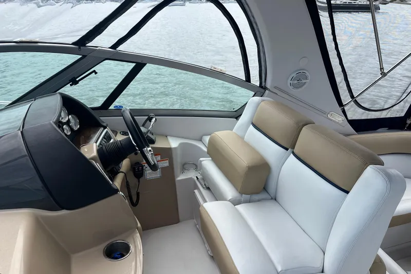 Slide: The Image of Interior of 2008 Four Winns 338 Vista boat with steering wheel and seating. - 35