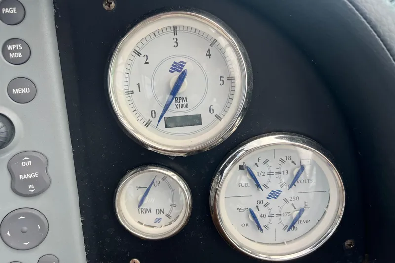 Slide: The Image of Dashboard gauges of a 2008 Four Winns 338 Vista boat, showing RPM, fuel, and voltage. - 40