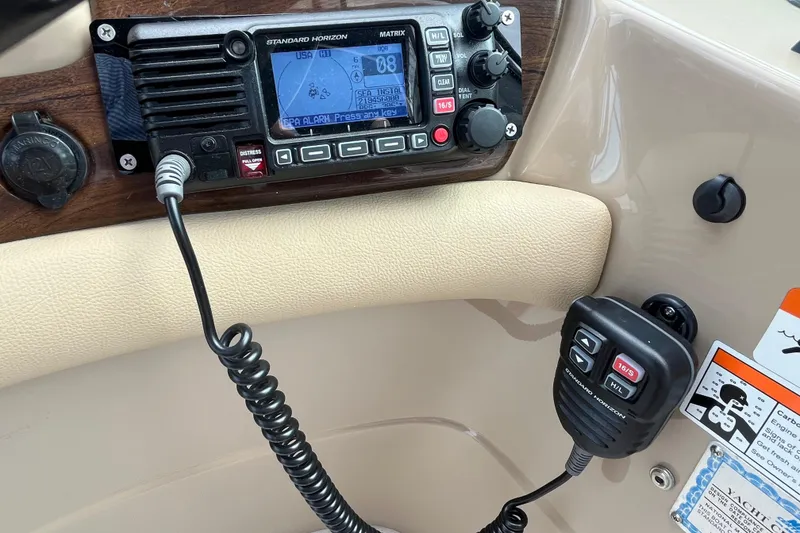 Slide: The Image of Control panel of a 2008 Four Winns 338 Vista boat with radio and microphone. - 42