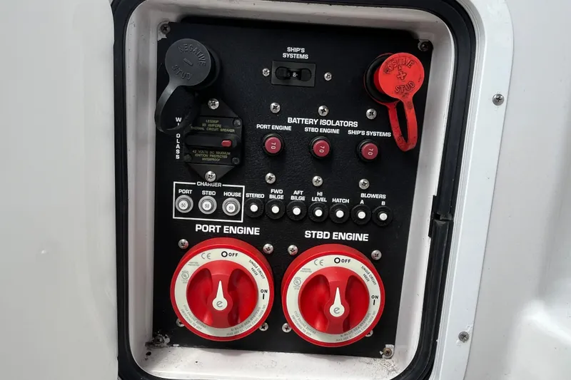 Slide: The Image of Control panel of a 2008 Four Winns 338 Vista boat with battery isolators and switches. - 44