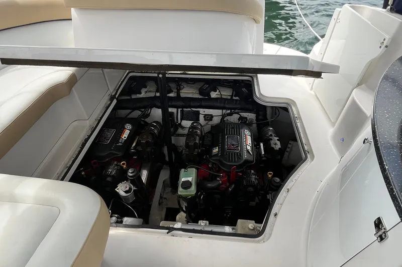 Slide: The Image of Engine compartment of a 2008 Four Winns 338 Vista boat, showcasing dual engines. - 46