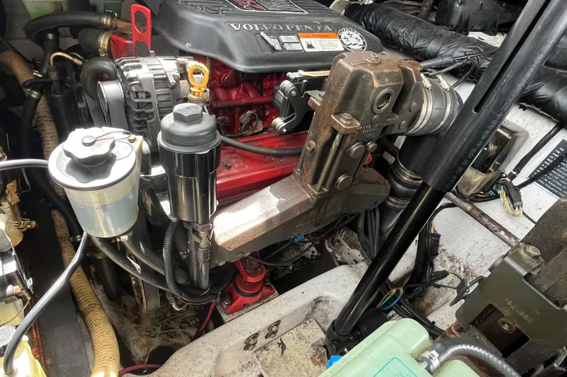 Slide: The Image of Engine compartment of a 2008 Four Winns 338 Vista boat, featuring a Volvo Penta engine. - 49