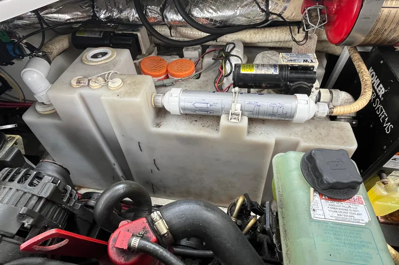 Slide: The Image of Engine compartment of 2008 Four Winns 338 Vista boat, showing water tank and components. - 51
