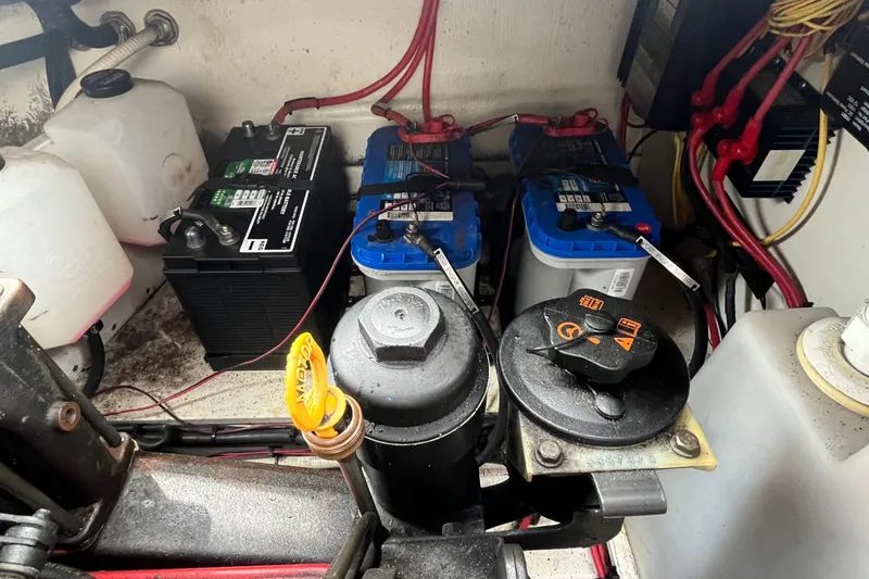 Slide: The Image of Engine compartment of a 2008 Four Winns 338 Vista with batteries and wiring. - 52