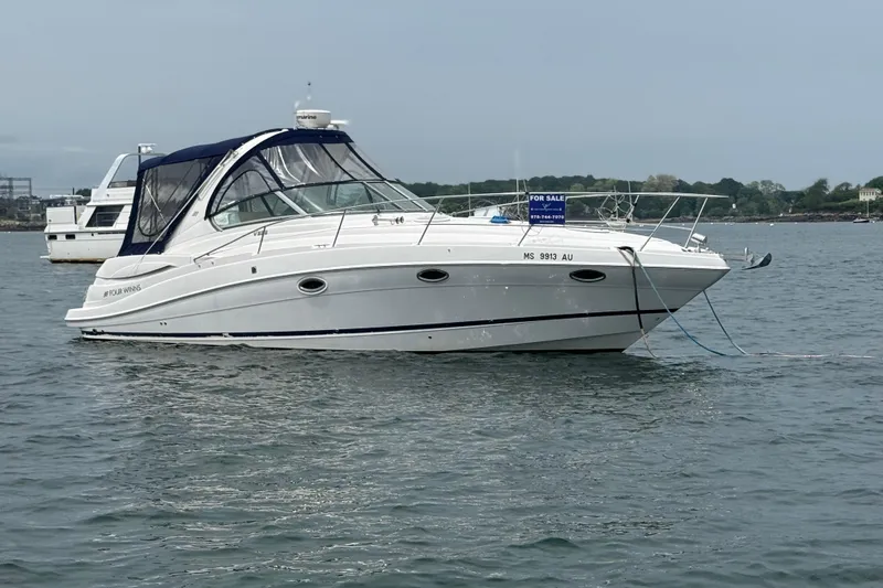 Slide: The Image of 2008 Four Winns 338 Vista boat anchored on water, for sale sign visible. - 7