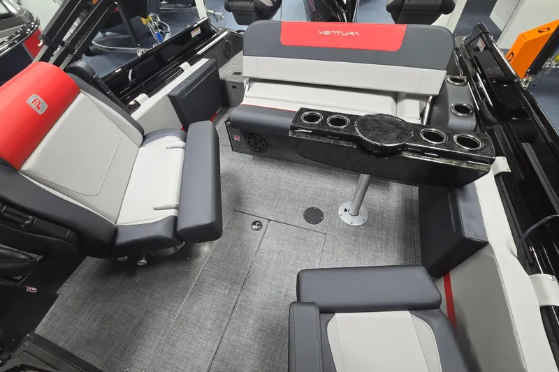 Slide: The Image of Interior of 2026 Princecraft Ventura 230 WRL boat with modern seating and table. - 15