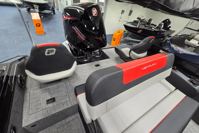 Slide: The Image of 2026 Princecraft Ventura 230 WRL boat interior with seating and motor. - 22