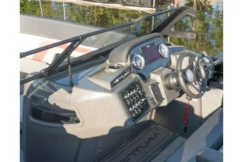 Slide: The Image of Manufacturer Provided Image: 2025 Princecraft Ventura 230 WRL boat dashboard with steering wheel and controls. - 4