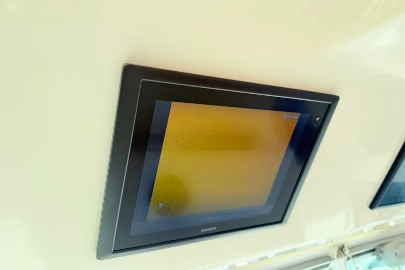 Slide: The Image of Garmin display screen on 2015 Grady-White Express 370 boat, featuring FLIR technology. - 11