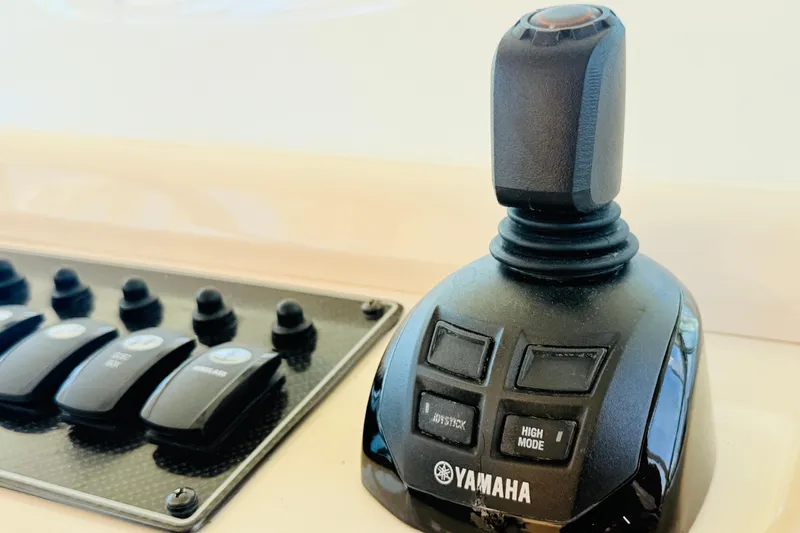 Slide: The Image of Yamaha joystick control on 2015 Grady-White Express 370 boat dashboard. - 16
