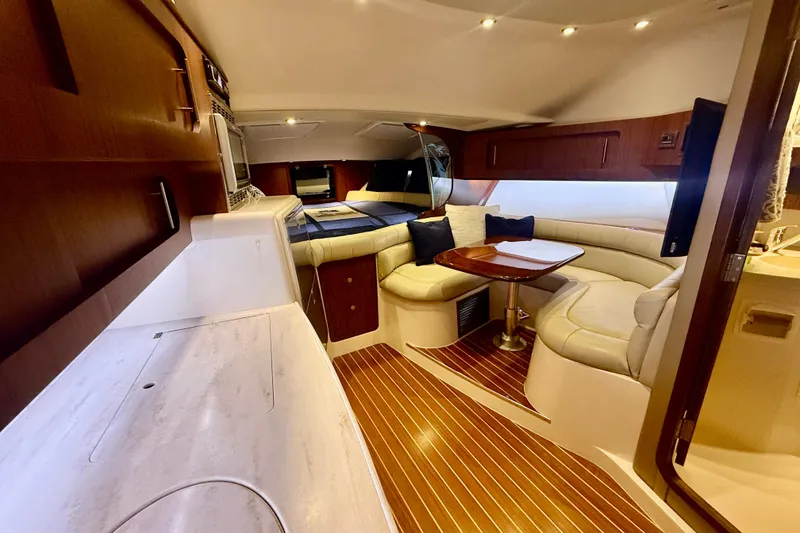 Slide: The Image of Luxurious interior of 2015 Grady-White Express 370 yacht with elegant seating and wooden accents. - 20
