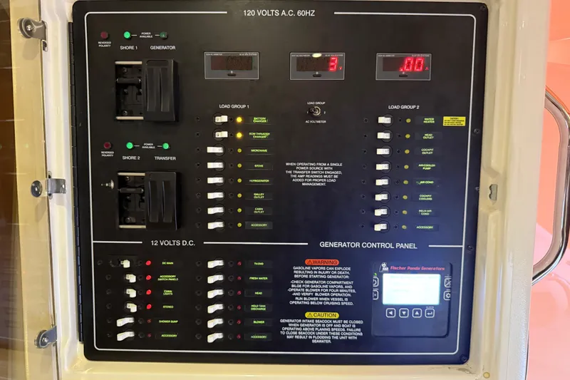 Slide: The Image of Electrical control panel on a 2015 Grady-White Express 370 boat. - 33