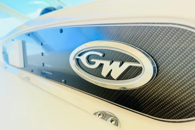 Slide: The Image of Close-up of Grady-White Express 370 logo on carbon fiber panel, 2015 model. - 34