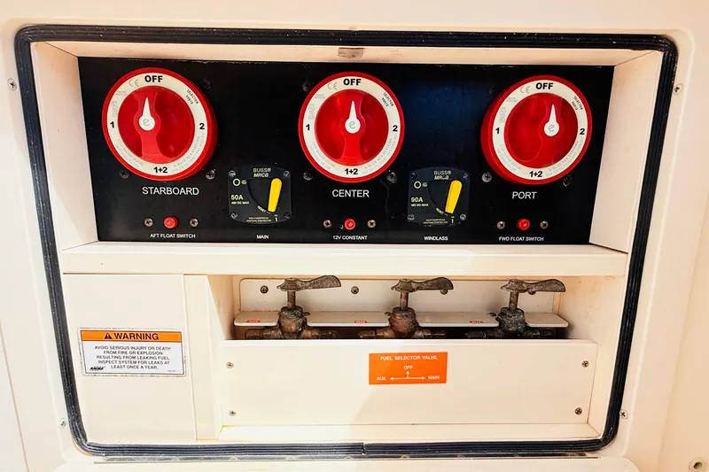 Slide: The Image of Control panel of a 2015 Grady-White Express 370 boat with battery switches. - 36